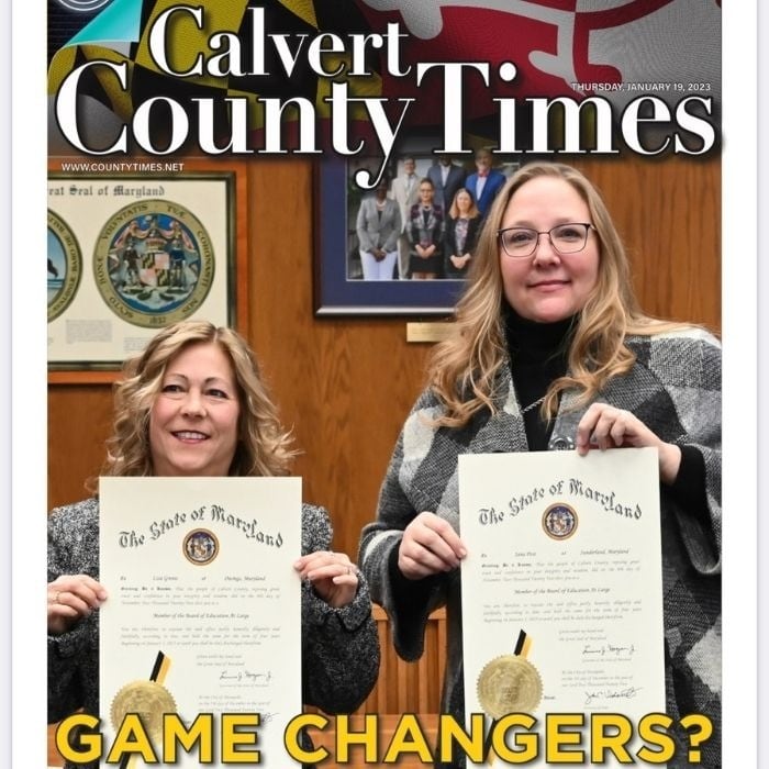 Calvert County Times front page featuring Lisa Grenis and Jana Post holding their State of Maryland certificates